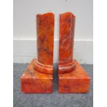 A pair of orange marble book ends