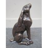 A cold cast resin bronzed figure of a hare moon-gazing,