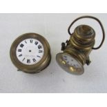 A brass clock in the form of a vintage lamp and a S.