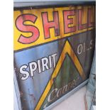 An enamel sign "Shell spirit oils Garage"