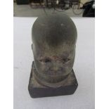 A baby head form bonnet mascot stamped 735664REG - mounted