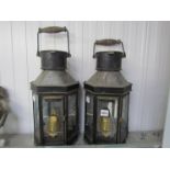 A pair of bull pit carriage lamps