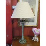 A weathered bronzed finish metal table lamp of palm tree design,