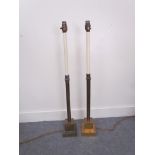 A pair of brass table lamps with stepped plinth bases,