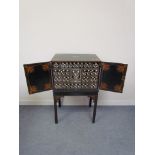 A 19th Century ebonised cabinet on stand,