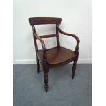 A circa 1840 East Anglian elbow chair the turned arm supports over a dished seat on turned legs