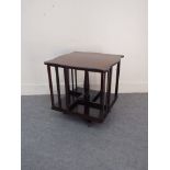 An Edwardian mahogany revolving table top bookshelf,