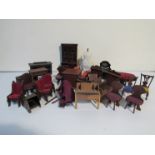 A box containing vintage dolls house furniture