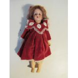 A 15" bisque head "Racnagal" doll