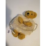 A Merrythought child's purse as a bear