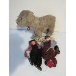 Two marionettes and a straw filled dog