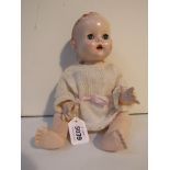 A Pedigree hard plastic jointed baby doll