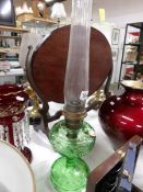 A 1940's Aladdin 'Washington Drape' green glass oil lamp