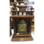 An oak 19th century 8 day mantel clock