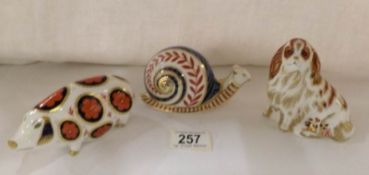 3 Royal Crown Derby paperweights, pig, snail and King Charles Spaniel
 
The spaniel has stopper