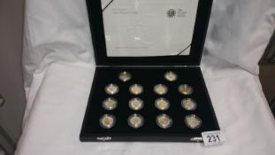 A cased set of 14 silver proof £1 coins