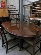 An extending mahogany dining table and 8 Victorian mahogany dining chairs
