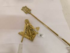 A Masonic brass door knocker and a brass Masonic toasting fork