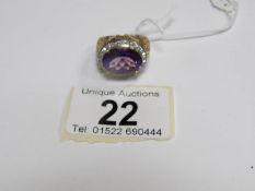 A 9ct gold ring set fine oval amethyst and pave' diamonds,