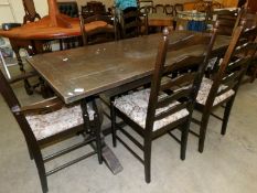 An oak refectory table and 6 ladderback dining chairs