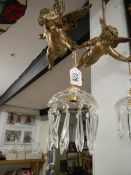 A hanging cherub ceiling light
 
These are both Spelter
Late 20th century