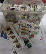 A large box of loose stamps