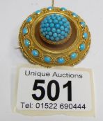 A Victorian turquoise locket back brooch with safety chain in 18ct gold