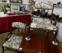 A pair of Edwardian mahogany arm chairs