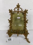 A Victorian gilt metal easel photo frame