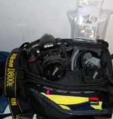 A Nikon D800E camera with many accessories including speed light, lenses, grips etc
 
All