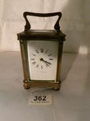 A brass carriage clock by Walter Freeman