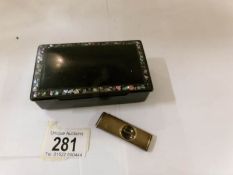 A lacquered snuff box and a cigar cutter