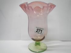 An Edwardian vaseline and cranberry glass vase
 
This is in good condition for the year, with no