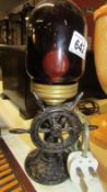 A cast iron ship's wheel table lamp