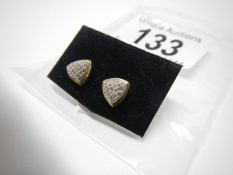 A pair of yellow gold triangular earrings