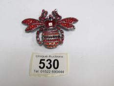 A Butler and Wilson bee brooch