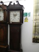 A mahogany mood dial Grandfather clock
 
30 hour non chiming movement
Pendulum has feather intact