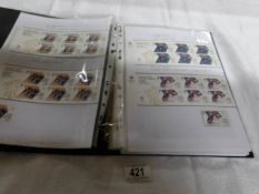 An album of 2012 Olympic and Paralympic mint stamps