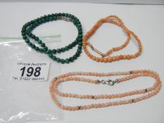 2 coral necklaces (1 silver & 1 gold clasp) and a malachite necklace