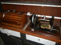 A vintage cased Douglas & Co., sewing machine