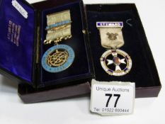 A Masonic silver gilt and enamel medal, 1811 and a silver gilt Masonic medal, 1936.