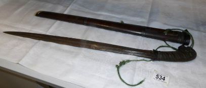 A Southern Asian sword with horn grip
Watered/folded blade and possibly silver mounts