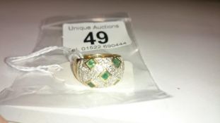 A 9ct gold ring set emeralds and pave' diamonds, size O
