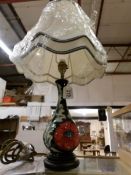 A Moorcroft lamp in poppy design by Rachel Bishop complete with Moorcroft silk shade,