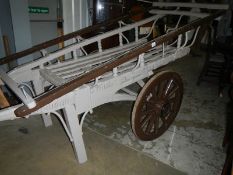 A Victorian hand cart
 
All woodwork and wheels in solid condition
There are traces of old
