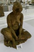 An old clay statue of a nude woman