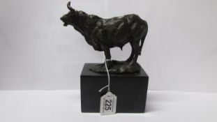 A bronze bull on marble base