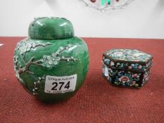 An Oriental cherry blossom ginger jar and a lidded enamel Oriental box