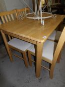 A kitchen table and 4 chairs