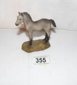 A small North Light sculpture of a horse